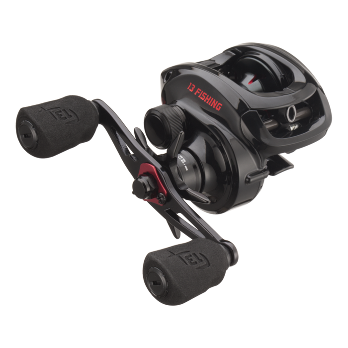 Black low-profile baitcasting fishing reel with red "13 Fishing" branding and dual ergonomic foam handles, designed for precision casting, model 13 Fishing Inception G2.