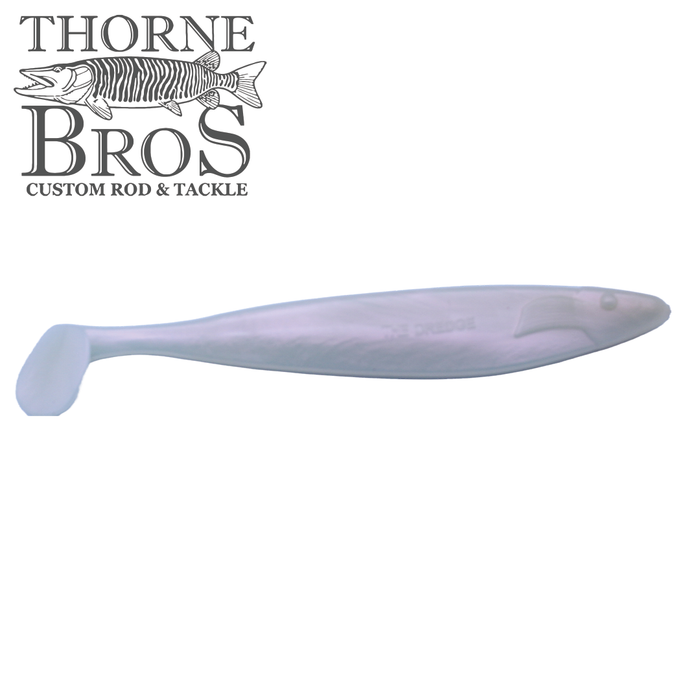Action Plastics 12" Dredge Shad fishing lure in translucent pearl color with a paddle tail, designed for musky and other freshwater fishing applications.