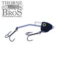 Barnestorm Baits X-Former fishing lure with black body, yellow eye detail, and two sharp treble hooks designed for musky fishing and fishing tackle enthusiasts.