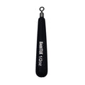 Black elongated fishing weight with a metal swivel at the top and white printed text reading BassTEK Tungsten Free Weight 1/2 oz, designed for fishing tackle use.