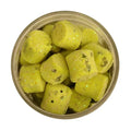 Container filled with bright yellow Berkley Gulp! Trout Nuggets fishing lures featuring small glitter flakes, designed for effective fishing tackle use.