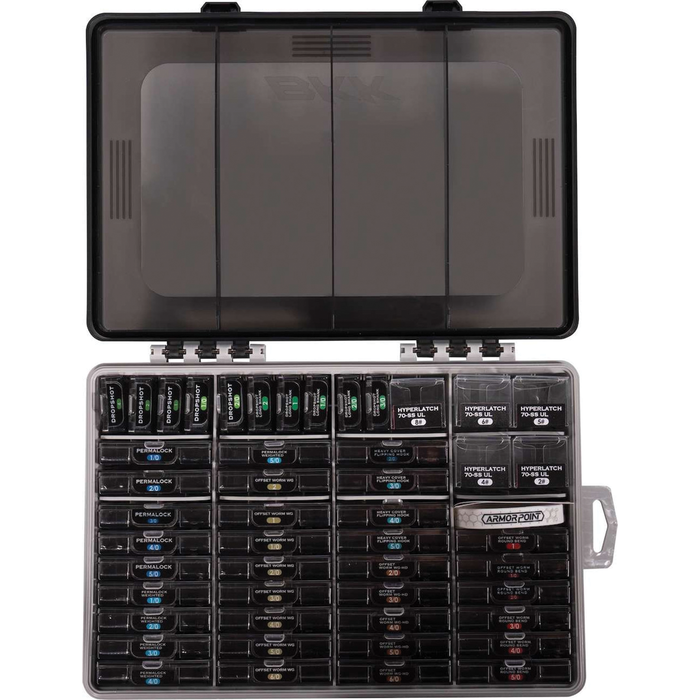 BKK OCD Tackle Storage System (Fully Loaded) showing a durable black plastic case with a transparent lid, containing multiple organized compartments filled with various fishing tackle including lures and hooks.
