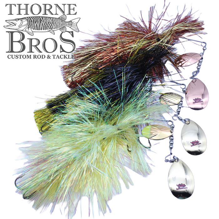 Three Blue Water Baits Gong Show 10 Magnum fishing lures in brown, black, and green colors with shiny spinner blades and feathered skirts, displayed next to Thorne Bros logo.