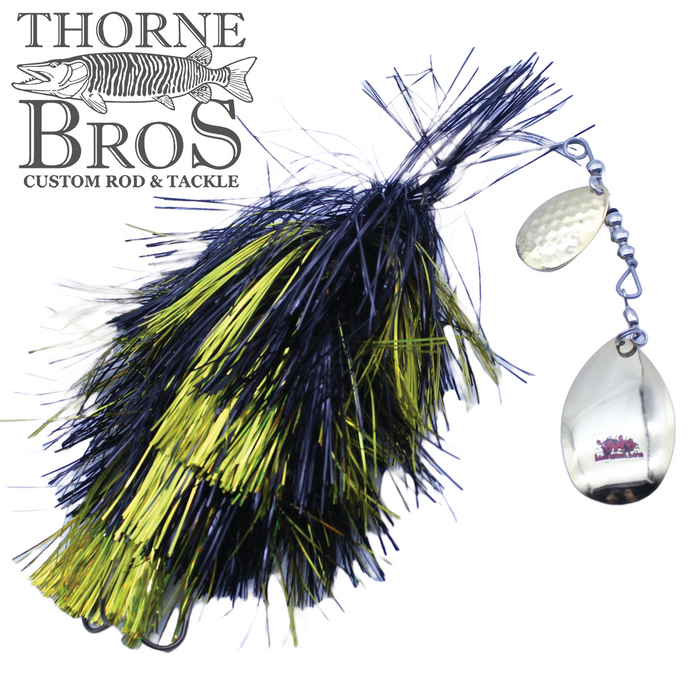 Blue Water Baits Gong Show 10 Magnum fishing lure featuring black and chartreuse synthetic fibers with silver spinner blades, designed for musky fishing.
