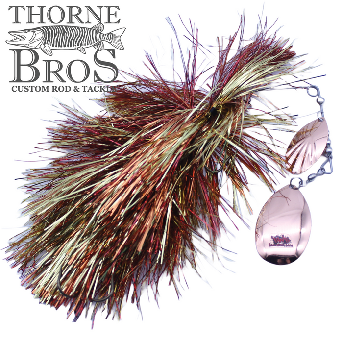 Blue Water Baits Gong Show 10 Magnum fishing lure with metallic copper and gold tinsel strands and two reflective spinner blades, designed for musky fishing applications.
