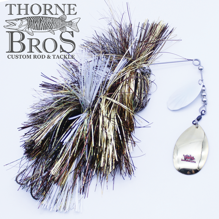 Blue Water Baits Gong Show 10 Magnum fishing lure with metallic tinsel and dual spinner blades, designed for attracting musky fish, displayed on a plain background with Thorne Bros logo.