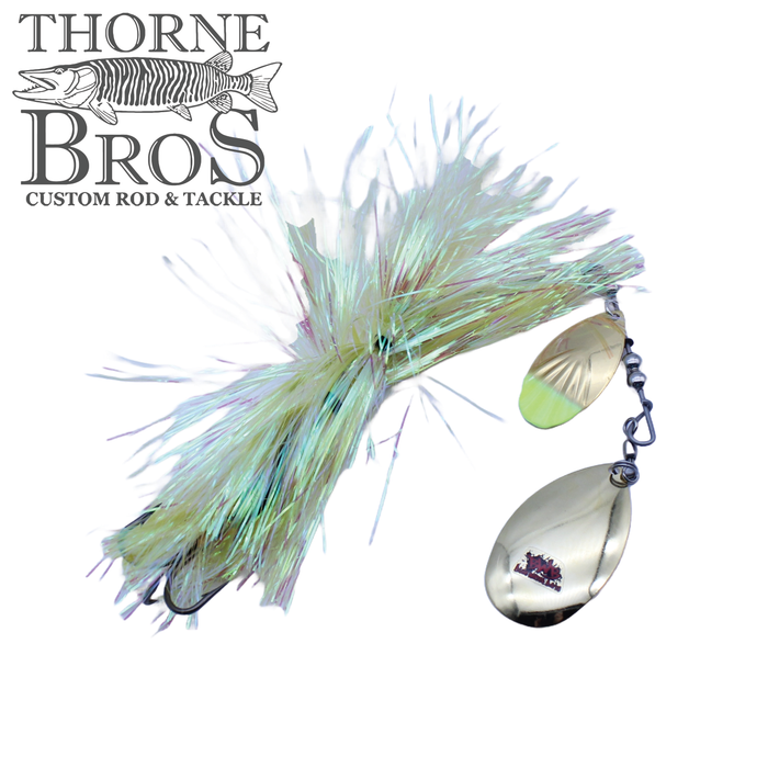 Blue Water Baits Gong Show 10 fishing lure featuring a shiny, iridescent skirt and two metallic spinner blades designed for musky fishing, displayed with Thorne Bros logo.
