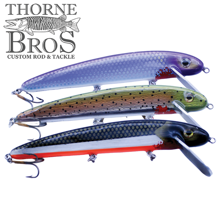Three B&N Magnum Claw - 11" Aluminum Lip fishing lures in purple, green, and black with red accents, each featuring multiple treble hooks and a large lip for deep diving.
