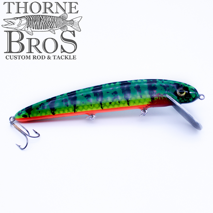 B&N Magnum Claw - 11" Aluminum Lip fishing lure with green and blue pattern, red underside, clear diving lip, and treble hooks designed for musky fishing tackle.