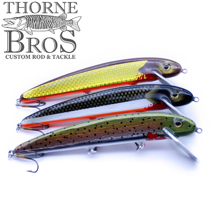 Three detailed fishing lures with reflective, multicolored bodies and metal hooks, each featuring the B&N Magnum Claw - 9.5" Aluminum Lip design, displayed on a white background with the Thorne Bros logo.