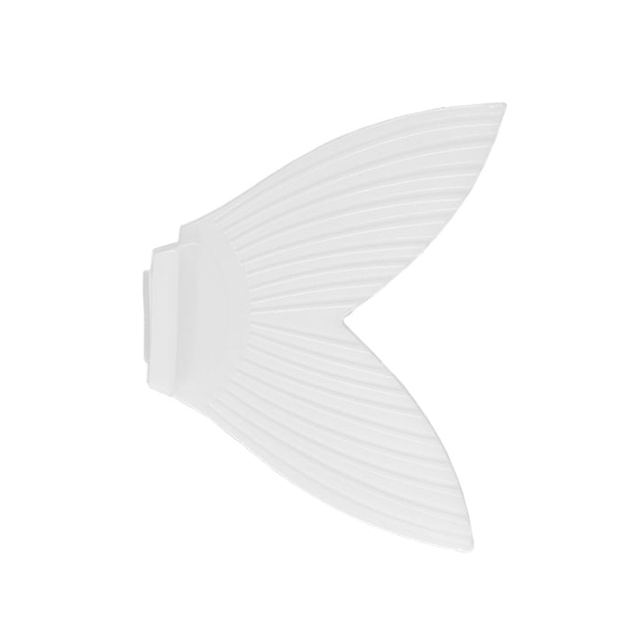 White flexible soft plastic fin-shaped Bucca Trick Shad Replacement Tails used for fishing lures and tackle to mimic fish movement in water.