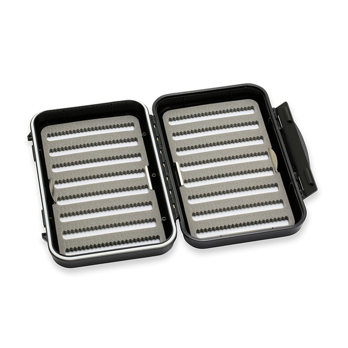 Open black and gray C&F Design Fly Boxes with multiple foam-lined rows designed to securely hold and organize fishing lures and fly fishing tackle.