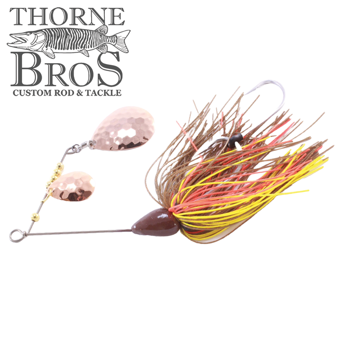 CJ'S Small Tandem Silicone fishing lure featuring dual hammered copper blades and a silicone skirt in brown, yellow, and red hues designed for musky fishing.