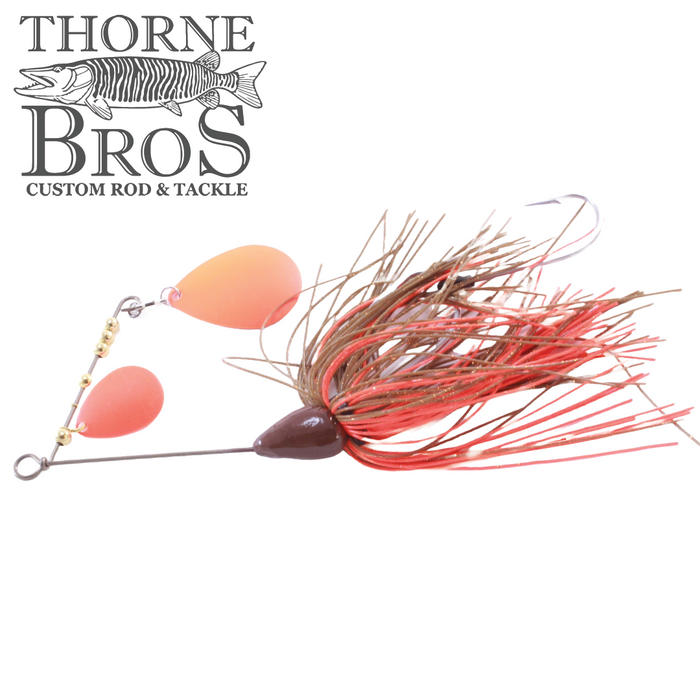 CJ'S Small Tandem Silicone fishing lure featuring two bright orange silicone blades and a red and brown skirt designed for musky fishing, displayed on a white background.