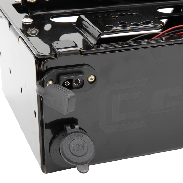 Close-up of the black Clam Ice Electronics Shuttle showing its 12V power port and electrical connector on the durable metal casing designed for marine electronics use.