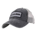 Clam Legacy Trucker Hat in faded black with a mesh back for breathability and a curved brim, featuring a stitched rectangular logo patch on the front.