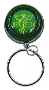 Dr. Slick Pin on and Clip on Reels featuring a compact, round green casing with fishing logo and attached metal keyring for convenient fishing tackle or gear organization.