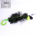 Drop Tine Base Jumper fishing lure with black and green tinsel skirt, bright chartreuse tail, yellow and black spinner blades, and an attached fishing weight.