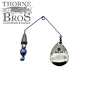 Drop Tine Growler Arm Attachment fishing lure with metallic spinner blade, weighted wire frame, and swivel, designed for enhanced movement in musky fishing tackle setups.
