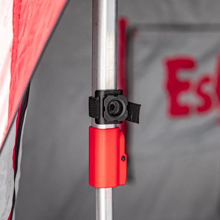 Close-up view of a secure metal pole attachment with black and red connectors inside an Eskimo E-Hub Flip Shelter Base (2 Pack) featuring fabric panels and fastening straps.