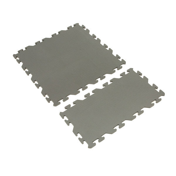 Two interlocking gray foam pieces with textured surfaces displayed separately, part of Eskimo Floor Tile Kits designed for durable floor protection and comfort.