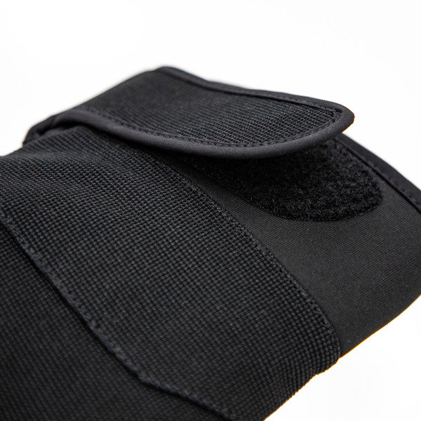 Close-up of the black Eskimo Hole Hopper Glove showing durable fabric with textured grip and adjustable Velcro strap for secure fit, designed for cold-weather fishing.