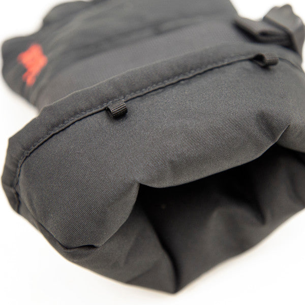 Close-up view of a black Eskimo Lockout Flex Glove made from durable fabric, designed for comfort and protection during fishing and outdoor activities.