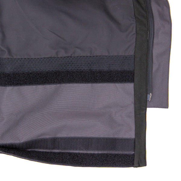 Close-up image showing the interior lining and adjustable hook-and-loop straps of the Eskimo Roughneck Bib - Men's, designed for secure fit and durability in fishing and outdoor activities.
