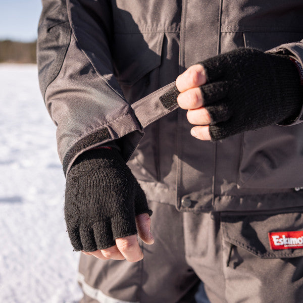 Eskimo Roughneck Jacket - Men's shown in gray with adjustable wrist closure, worn over black fingerless gloves, suitable for cold weather fishing and outdoor activities.