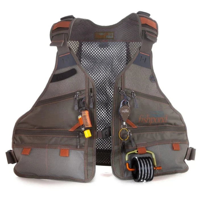 Fishpond Flint Hills Vest in brown and gray with multiple zippered pockets, mesh back for ventilation, and fishing accessories attached for tackle and gear organization.