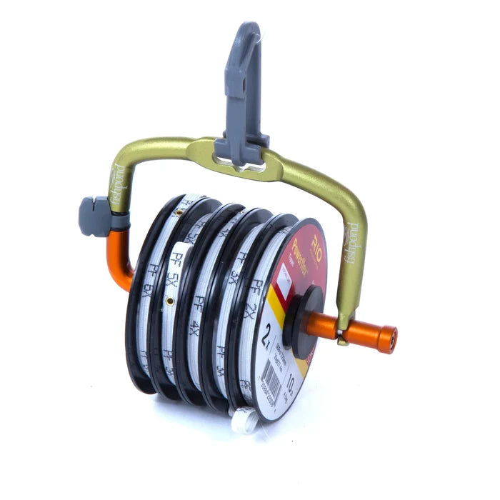 Fishpond Headgate Tippet Holder in gold and orange, designed to securely hold multiple spools of fishing tippet material for easy access while fly fishing.