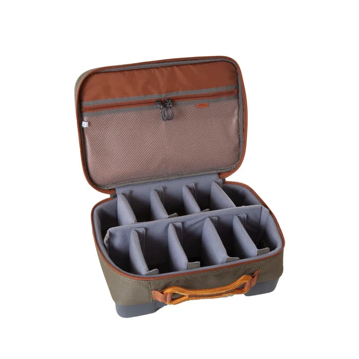 Open Fishpond Honcho Reel Case in earth tones showing padded, adjustable compartments for organizing and protecting fishing reels and tackle accessories.