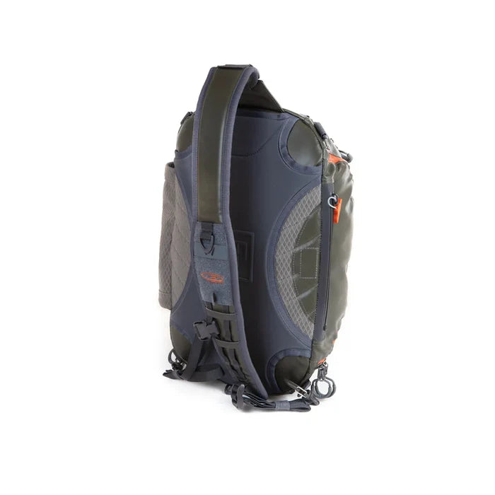 Fishpond Stormshadow Sling Pack in dark color with padded adjustable shoulder strap, side pockets, and durable water-resistant material designed for fishing tackle organization.