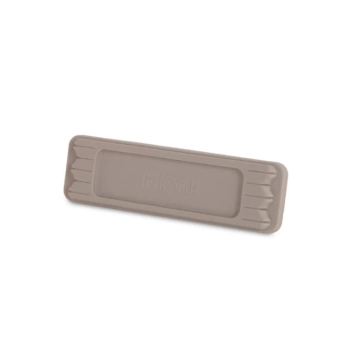 Fishpond Tacky Fly Doc MagPad, a rectangular taupe magnetic fly dock with a textured surface designed to securely hold fishing flies in place during fly fishing and tackle organization.