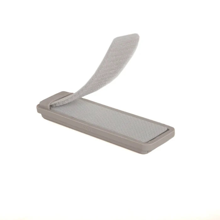 Fishpond Tacky Fly Doc MagPad in gray with a Velcro surface and an open flap, designed for securely holding fishing flies and tackle accessories.