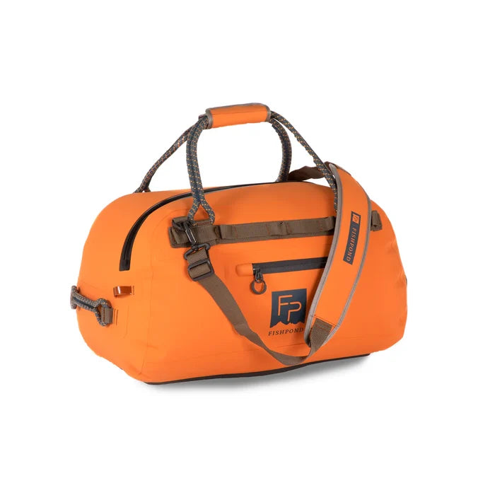 Bright orange Fishpond Thunderhead Submersible Duffel Bag with sturdy rope handles, adjustable padded shoulder strap, front zip pocket, and durable weather-resistant material.