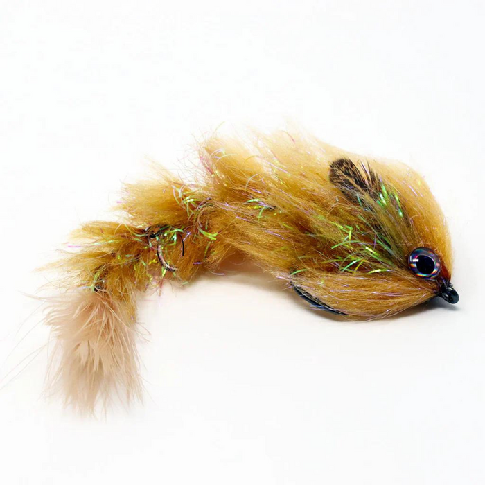 FlyMen PolarLite Changer fishing lure in brown with iridescent fibers and a curved hook, designed to attract fish with a lifelike fuzzy body and flowing tail.