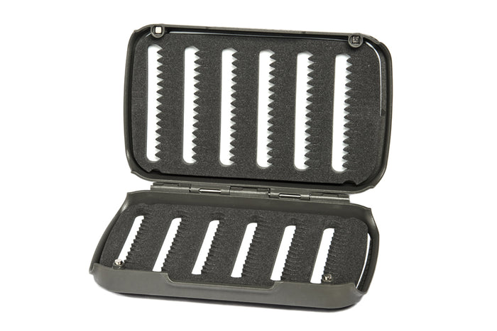 Fulling Mill Fly Patch Box open to show black foam insert with multiple slots designed for securely holding fishing flies, suitable for organizing fly fishing tackle.