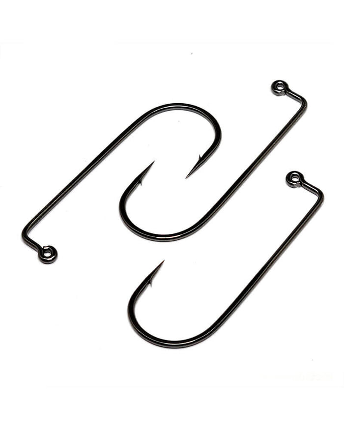 Two black heavy wire fishing hooks with sharp points and eyelets, designed in a 90 degree jig style, known as Gamakatsu 90 Degree Jig Hook, used for fishing tackle.