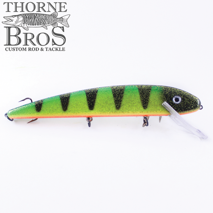 Grandma Lures 13" Crankbait fishing lure with a green and yellow glittery body, black striped pattern, detailed eye, and a clear angled plastic lip for realistic movement.