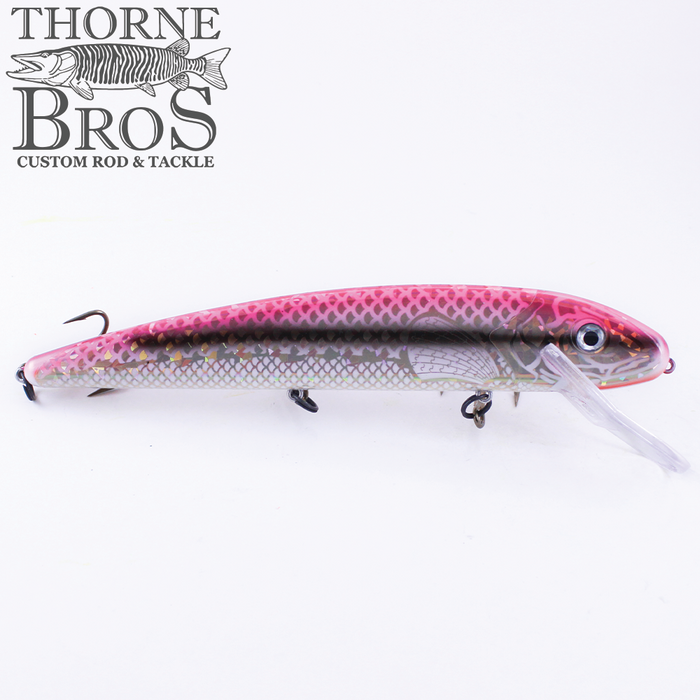 Grandma Lures 13" Crankbait fishing lure in pink and silver with a realistic scale pattern, two treble hooks, and a clear diving lip for effective fishing tackle use.
