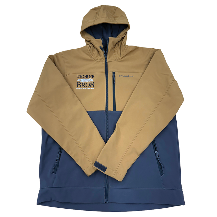 Grundens Thorne Bros. Logo Bulkhead Jacket in tan and navy blue, featuring a hood, full zip front, zippered pockets, and logos on the chest, designed for fishing and outdoor wear.