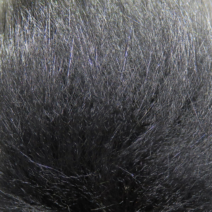 Close-up of soft, dense black and gray fur fibers of Hareline Arctic Fox Hair used for creating fishing lures and fishing tackle.