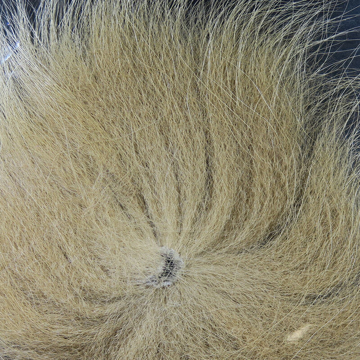 Close-up of light tan and cream Hareline Arctic Fox Tail Hair showing soft, fine strands ideal for creating custom fishing lures and fly fishing tackle.