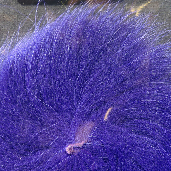 Close-up of vibrant purple Hareline Arctic Fox Tail Hair used for creating fishing lures and fly tying in fishing tackle.