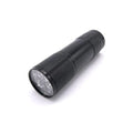 Compact black handheld flashlight with textured grip and multiple LED bulbs on the front, designed as the Hareline Universal UV Cure Light for fishing tackle use.