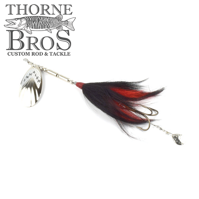 Inhaler 70 Bucktail fishing lure with silver spinner blade and black and red feathered tail, designed for musky fishing, showcasing premium fishing tackle craftsmanship.
