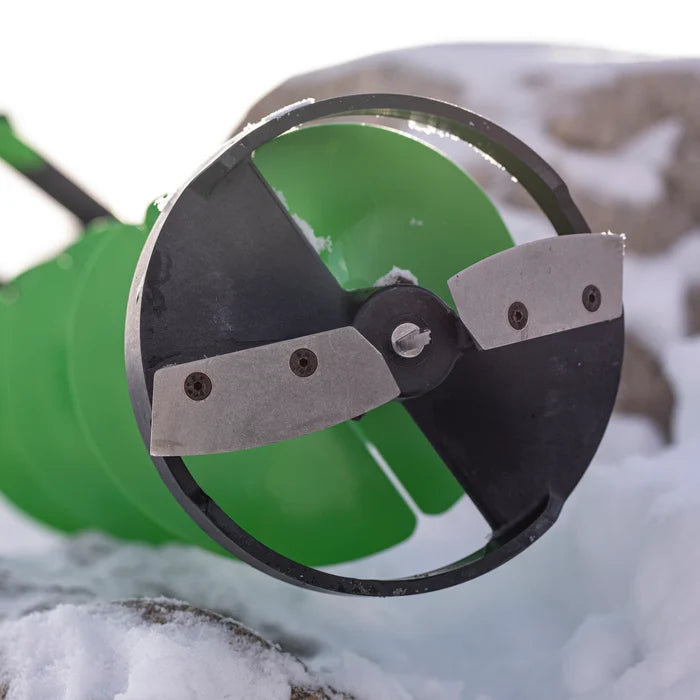 Close-up of the ION Turbo Blades (Previous Model) ice auger blade attachment with sharp metal edges set against a snowy outdoor background, used for ice fishing.