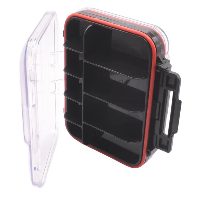 Kenders Double-Sided Compartment/Foam Waterproof Jig Box with clear hinged lid, multiple internal compartments, black foam inserts, and secure latch for organizing fishing tackle and lures.