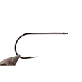 Close-up view of a Kona Big Game Carnivore Hook, a strong, sharp fishing hook designed for big game fishing, showing its sleek metal construction and precise barb for secure catches.